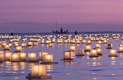Lanterns floating in the water during a pink sunset at the 15th Annual Lantern Floating Ceremony at Ala Moana Beach Park in Honolulu on Memorial Day print picture photo photograph fine art