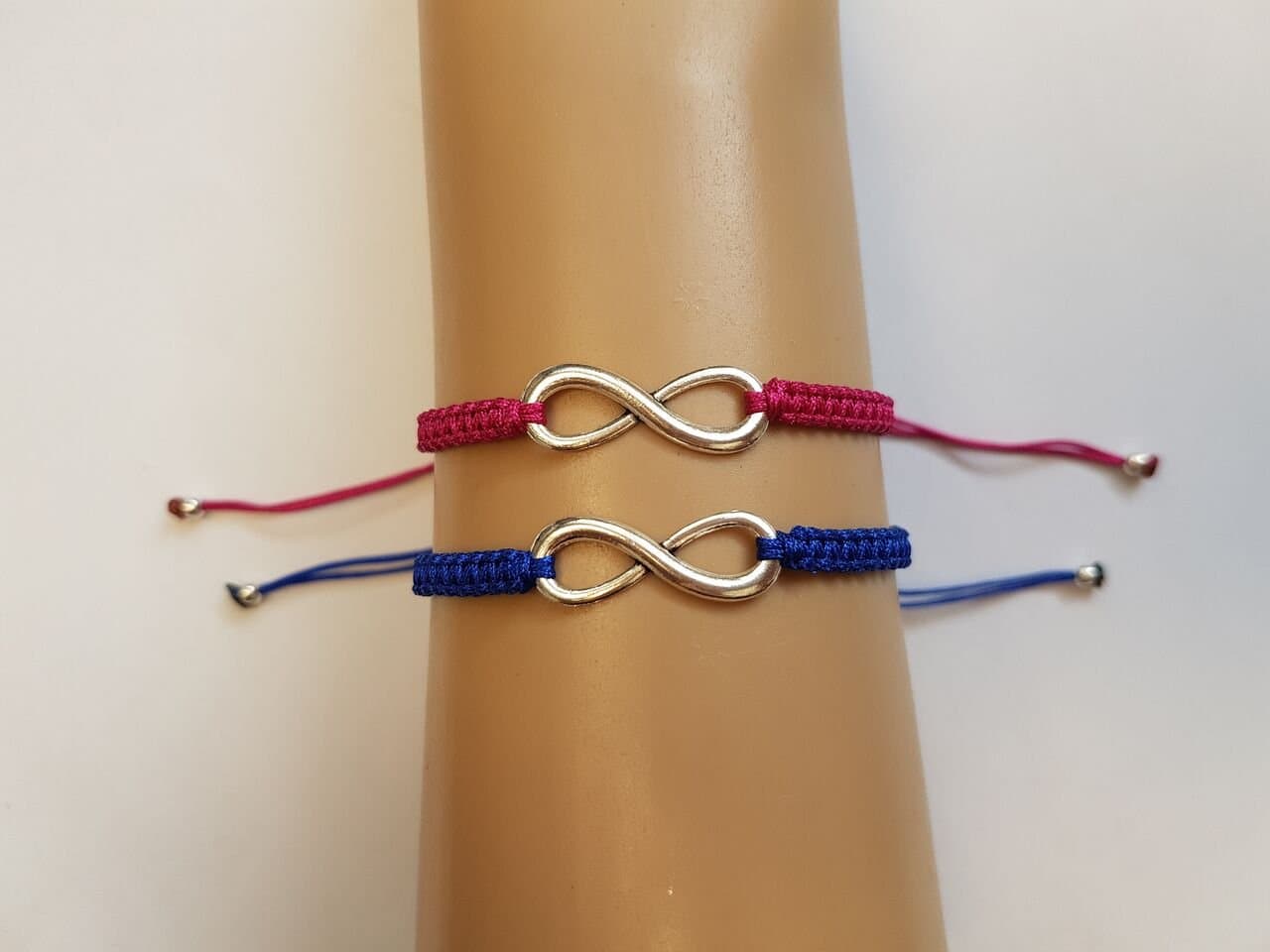 Couples infinity bracelet set with pink and blue cord
